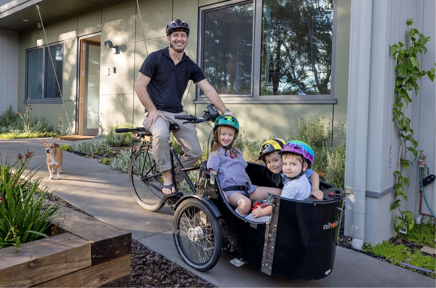The Nunn family outside their passivhaus