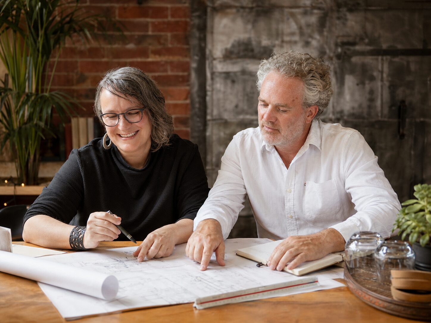 Talina and Andy working on some plans
